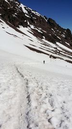 Scenic view of snow covered mountains against sky