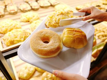 Close-up of hand holding sweet food