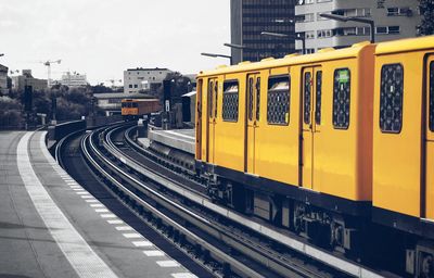 Train moving on tracks at station