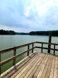 Pier over lake against sky
