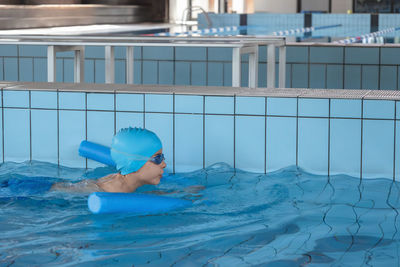 Young woman swimming in pool