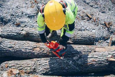 Close-up of man working on rock