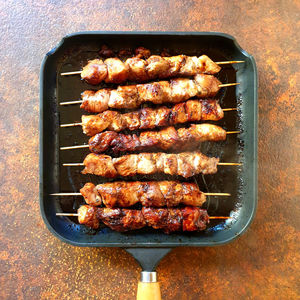 High angle view of meat on barbecue grill