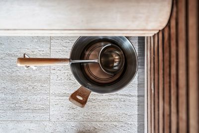 Directly above shot of water bucket inside the sauna