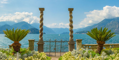 Scenic view of sea and mountains against sky