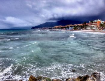 Scenic view of sea against cloudy sky