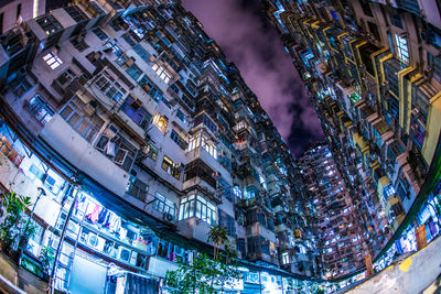 Low angle view of illuminated buildings at night