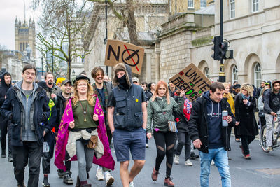 People standing on street in city