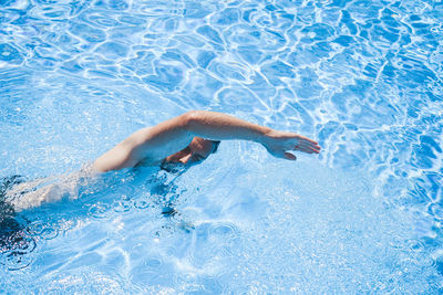 High angle view of man swimming in pool