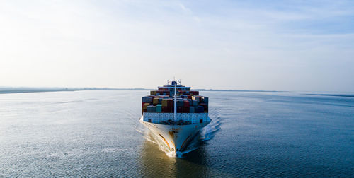 Nautical vessel on sea against sky