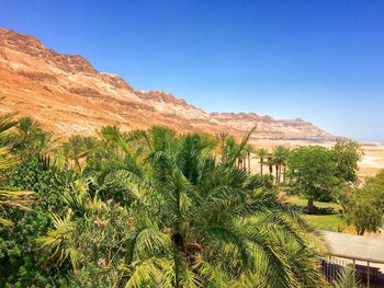 Scenic view of mountains against clear blue sky