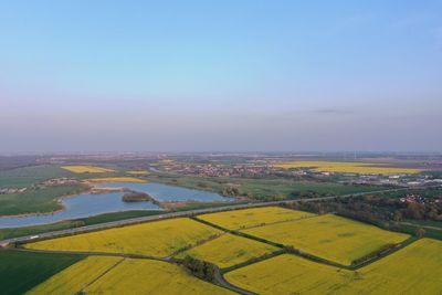 Aerial view of agricultural field against sky