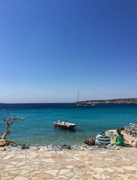 Scenic view of sea against clear blue sky