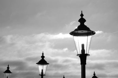 Low angle view of street light against building