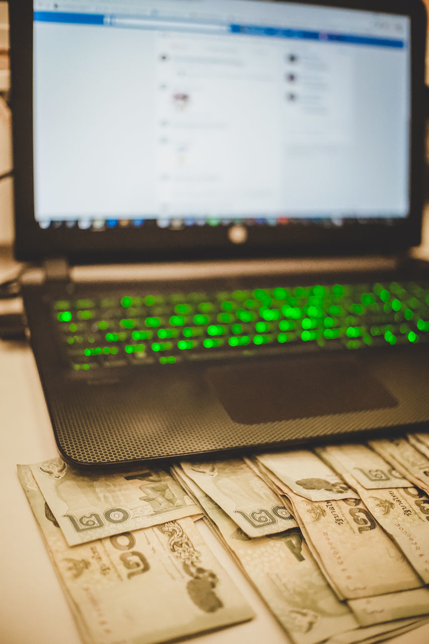 CLOSE-UP OF LAPTOP ON KEYBOARD