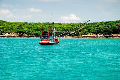 Boat in sea against sky