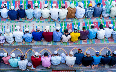 High angle view of people praying on road