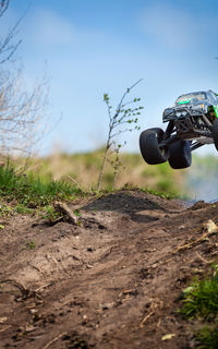 Monster truck over dirt field