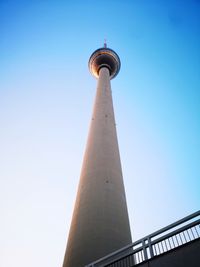 Low angle view of communications tower against sky