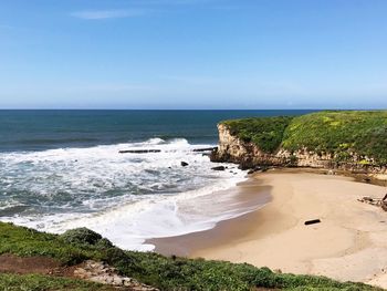 Scenic view of beach against clear sky