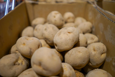 High angle view of potatos in container for sale