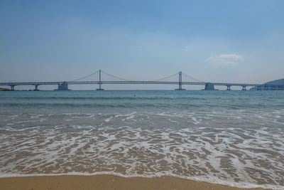 View of suspension bridge on beach