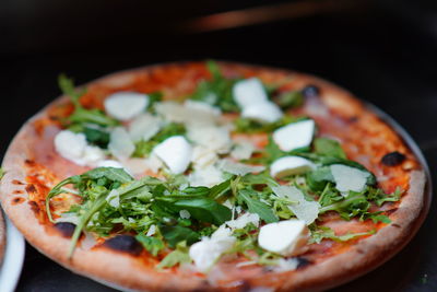 Close-up of pizza served in plate