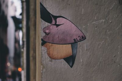 Close-up of heart shape hanging on wall