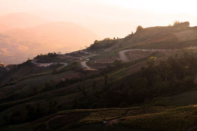 Scenic view of landscape against sky during sunset