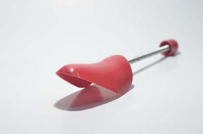 Close-up of colored pencils over white background