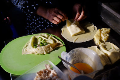 Close-up of person preparing food