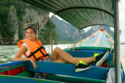 Portrait of young woman in boat