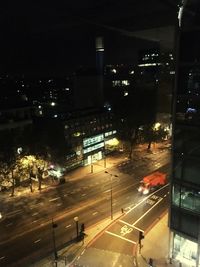 High angle view of vehicles on road at night