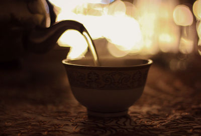 Close-up of coffee cup on table