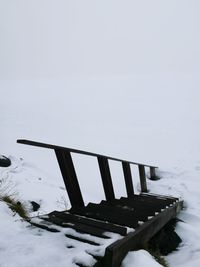 Scenic view of frozen lake against sky during winter