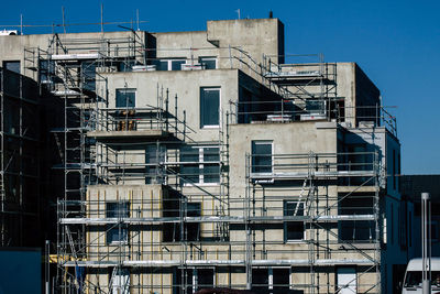 Low angle view of buildings against clear sky