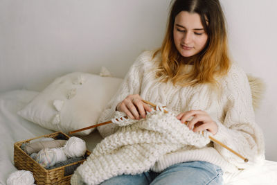 Teengirl knitting at home. handmade and hobby.