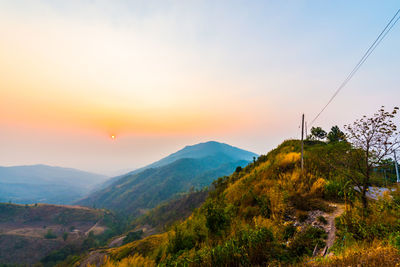 Scenic view of mountains against sky during sunset