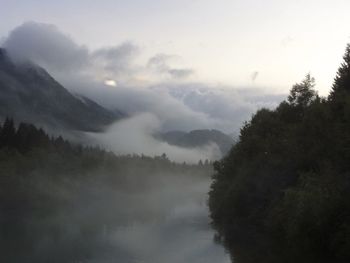 Scenic view of landscape against cloudy sky