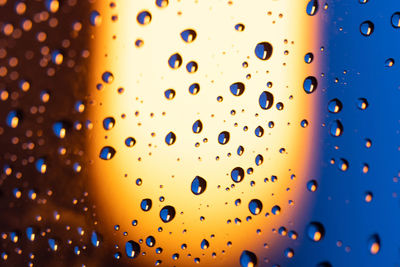 Close-up of water drops on glass