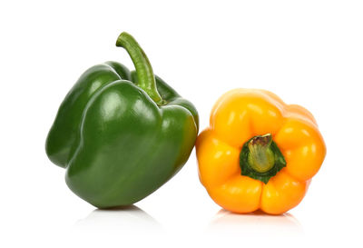 Close-up of bell peppers against white background