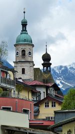 Buildings in city against sky