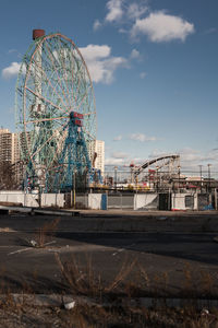 Ferris wheel against sky in city