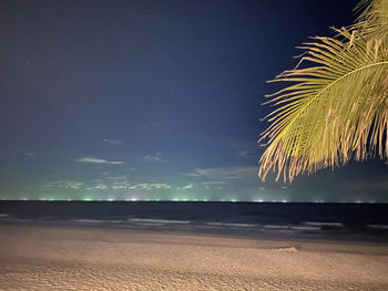 Scenic view of sea against sky at night