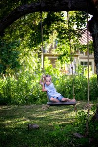 Boy on swing in park