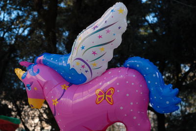 Close-up of multi colored unicorn balloon