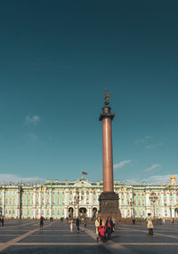 Group of people in front of historical building