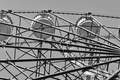 Low angle view of ferris wheel against sky