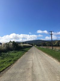 Empty road with mountain in background