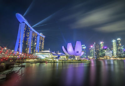 Illuminated buildings in city at night